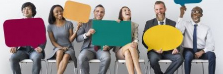 bank employees holding up speaking bubble boards for informational web site