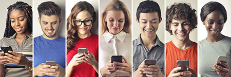 person holding a phone while on a computer for ebanking