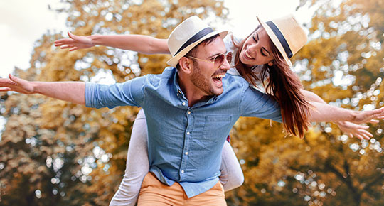 couple outside having fun with a cd savings account