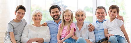 happy family sitting on the couch with a legacy