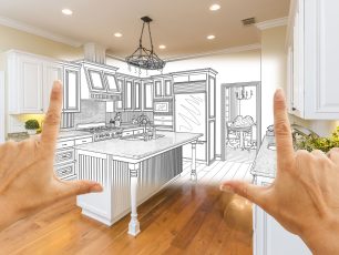 two hands point at a drawing of a kitchen for a remodel with a home equity loan