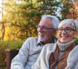 older couple sitting outside